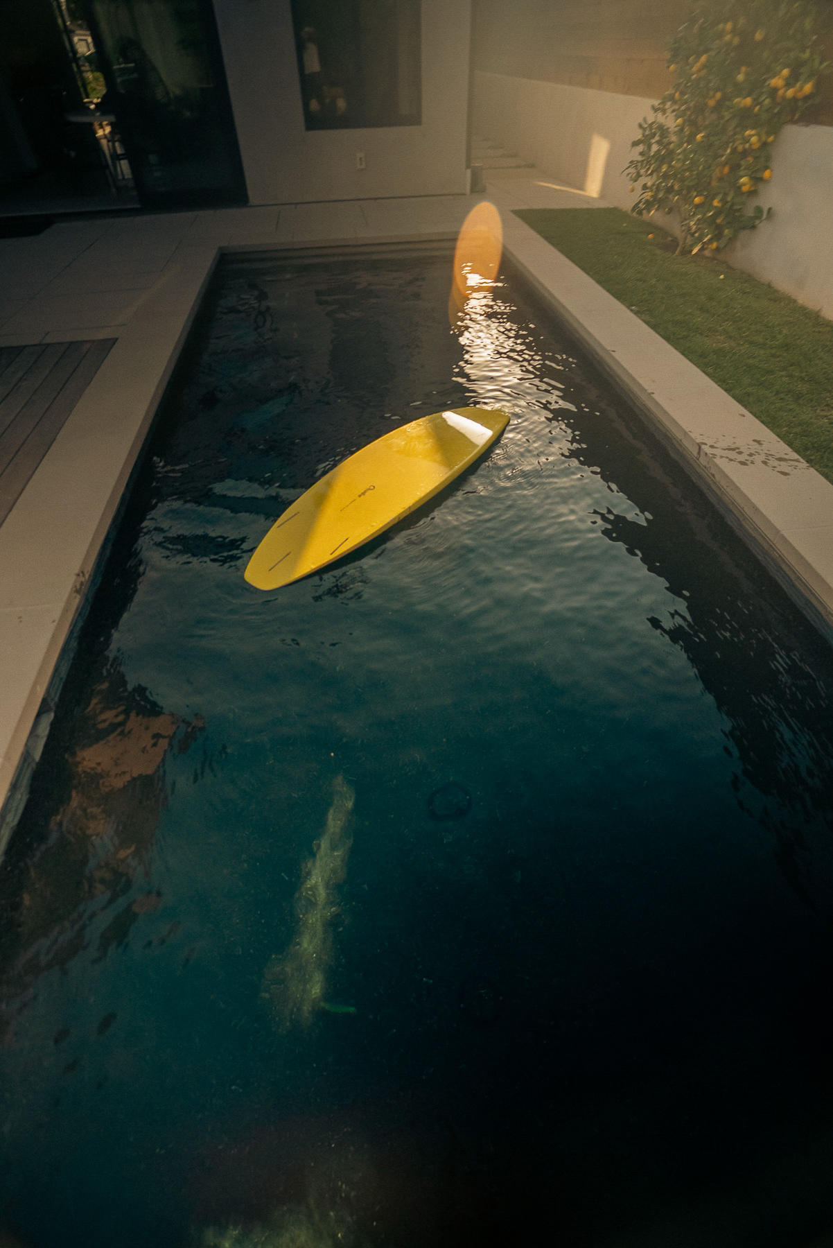 Lap pool with yellow paddleboard