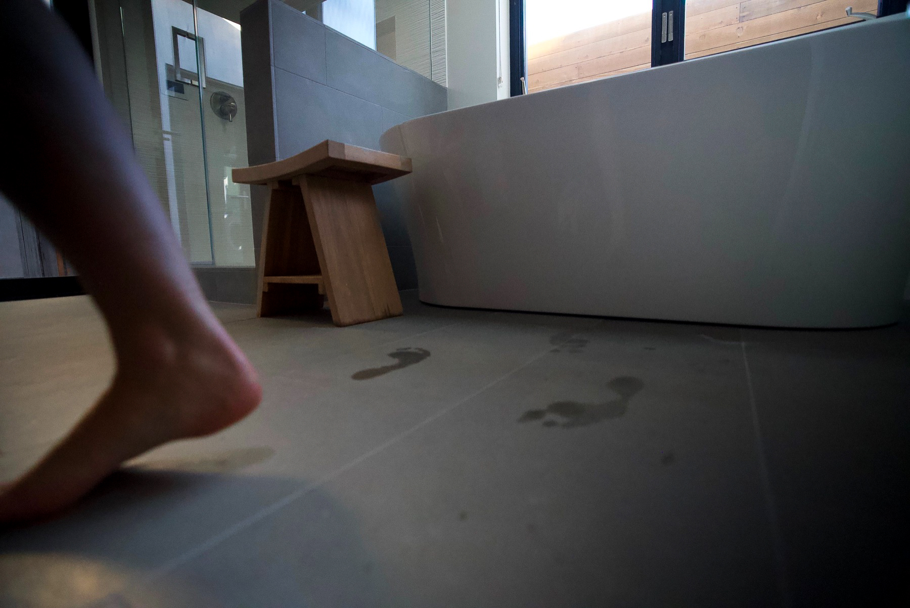 Footprints across the bath floor